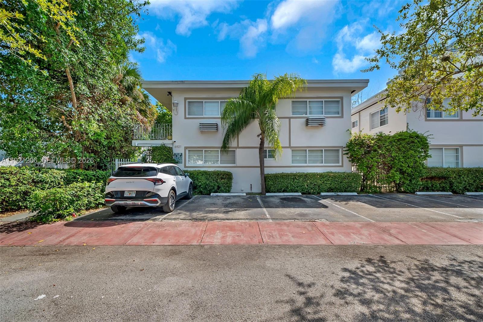 6921 Rue Vendome, Unit 1 Miami Beach, FL 33141 - Photo 26 of 27 a view of a car parked in front of a house