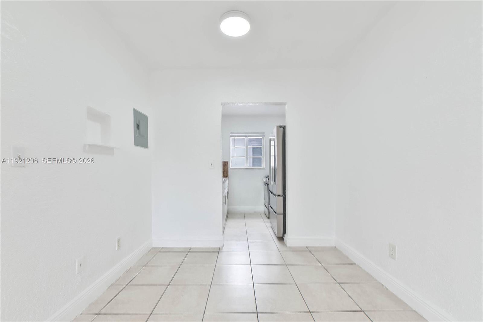 6921 Rue Vendome, Unit 1 Miami Beach, FL 33141 - Photo 3 of 27 an empty room with a bathroom