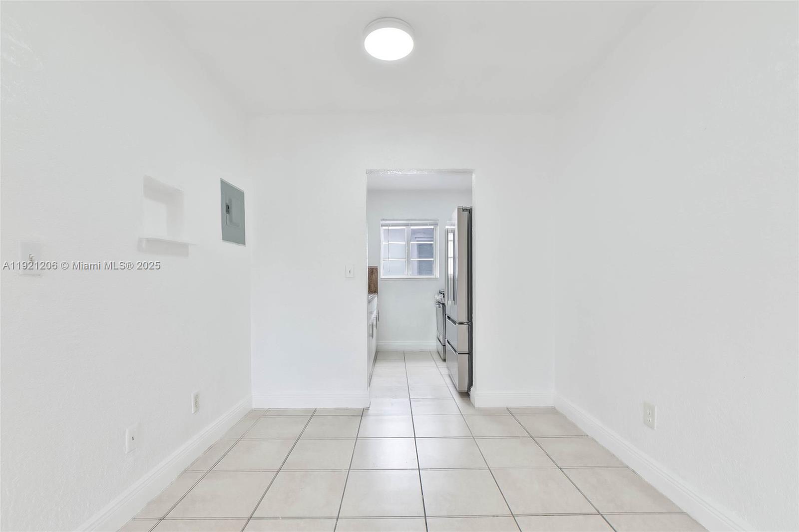 6921 Rue Vendome, Unit 1 Miami Beach, FL 33141 - Photo 3 of 23 an empty room with a bathroom