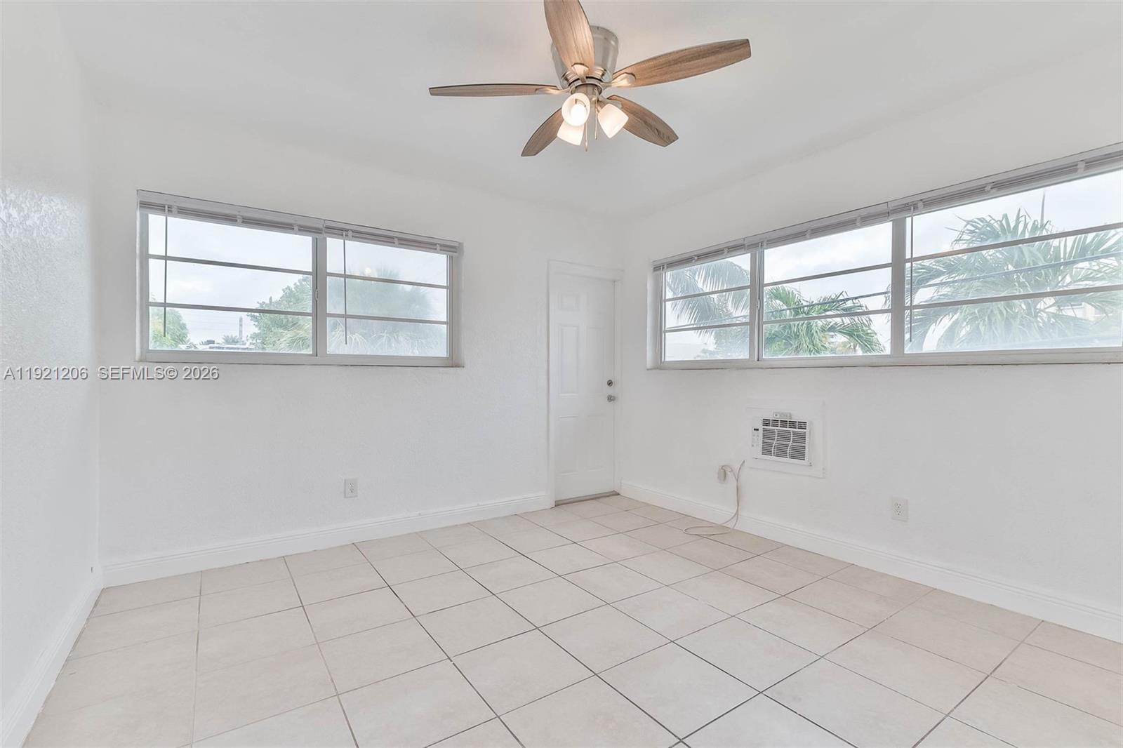 6921 Rue Vendome, Unit 1 Miami Beach, FL 33141 - Photo 8 of 27 a view of an empty room with a window