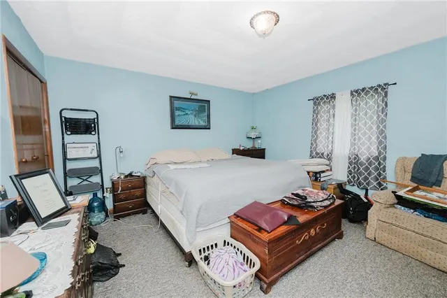 a bed room with a bed and a couch