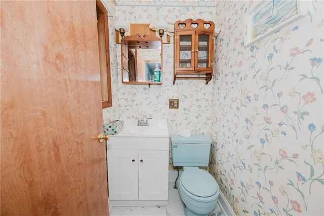 a bathroom with a toilet and a sink