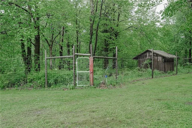 a view of a wooden deck and a yard