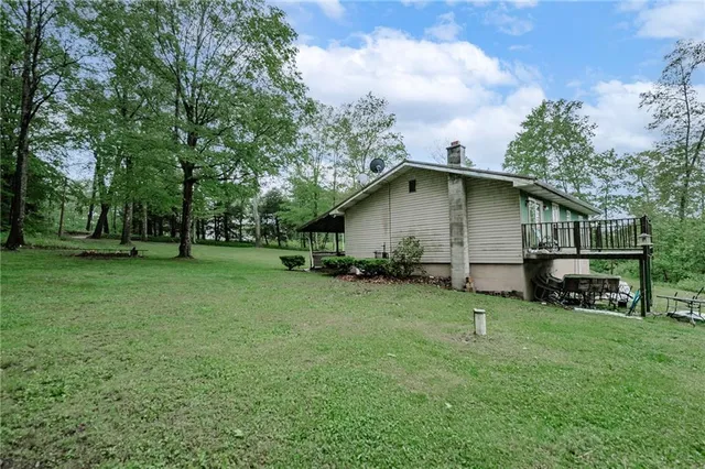 a view of backyard with garden and trees