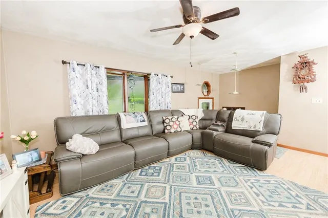 a living room with furniture and a rug