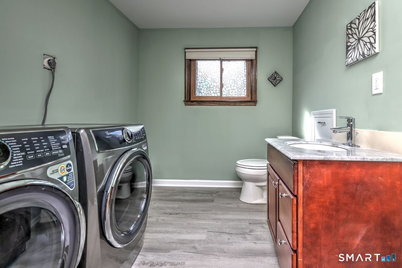 90 Brook Hill Road Hamden, CT 06514 - Photo 33 of 38 Half bath and laundry room in lower level