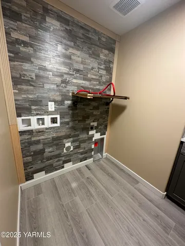 a view of room with wooden floor