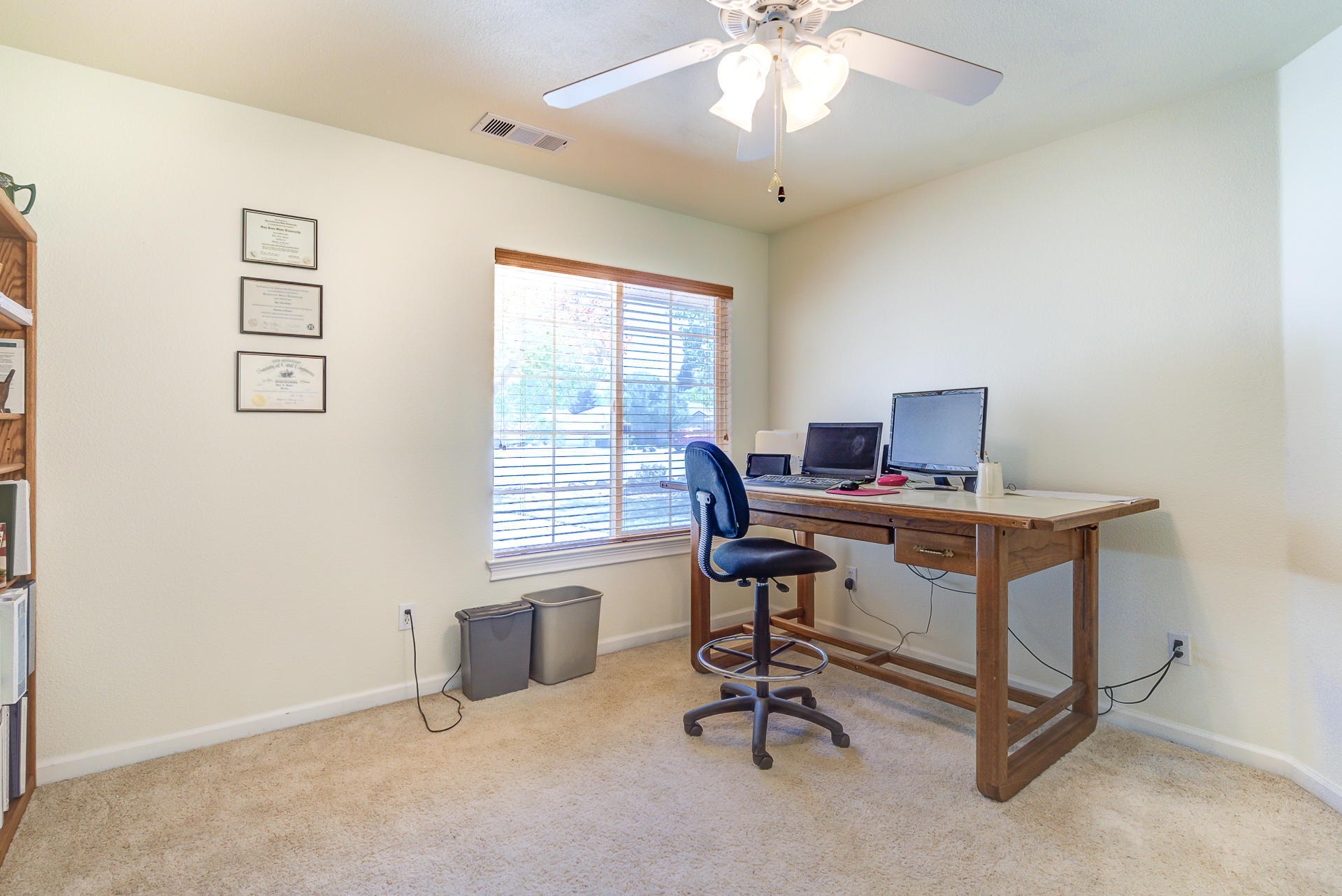 2697 Rhinestone Way Redding, CA 96001 - Photo 15 of 31 a view of a workspace with furniture and a window