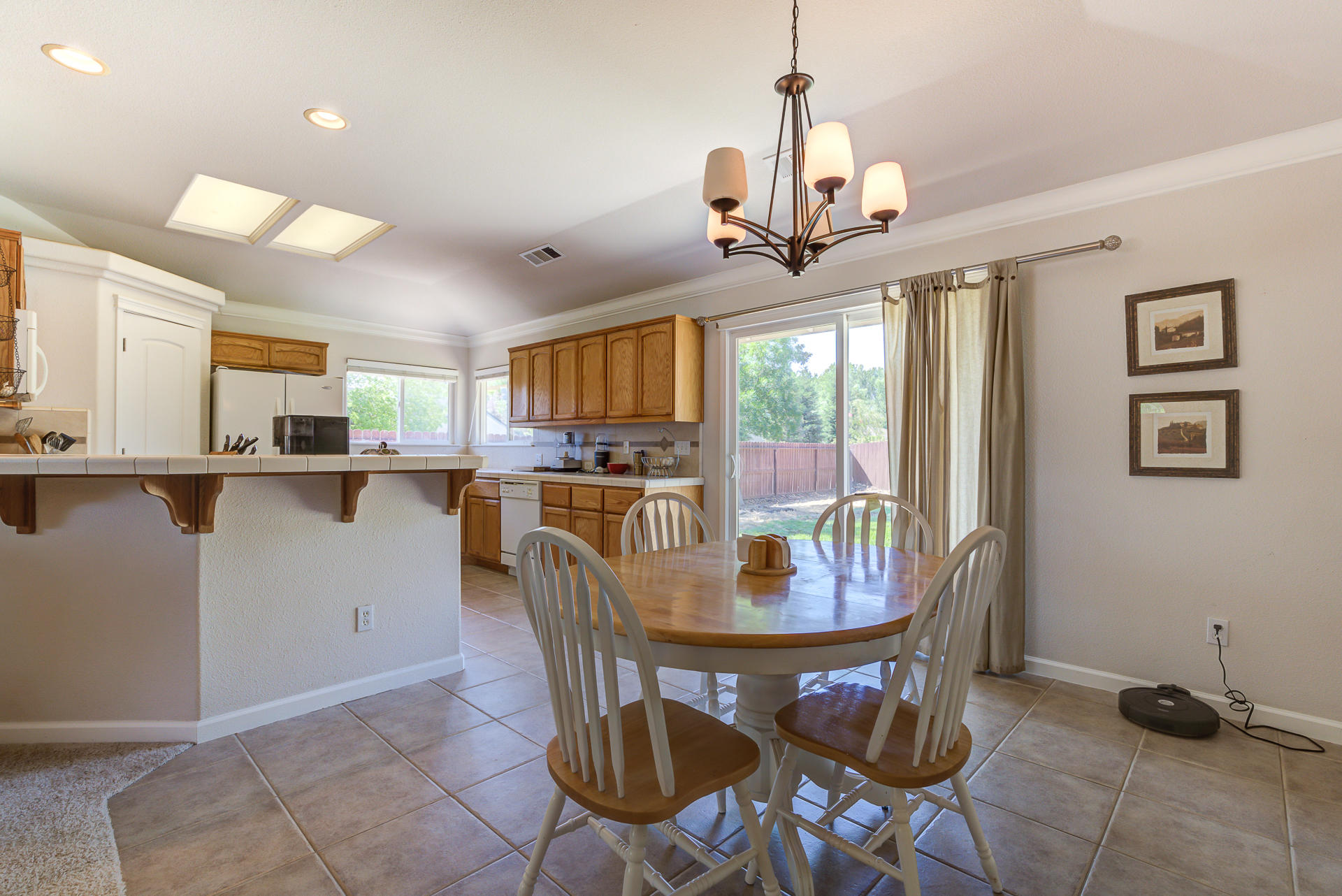 2697 Rhinestone Way Redding, CA 96001 - Photo 5 of 31 a view of a dining room with furniture window and wooden floor