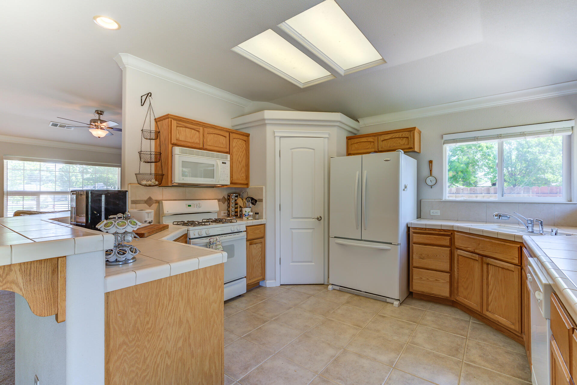 2697 Rhinestone Way Redding, CA 96001 - Photo 8 of 31 a kitchen with a refrigerator stove and sink