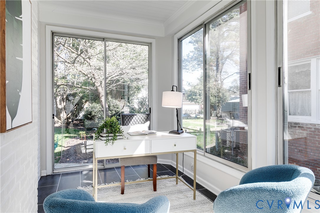 4617 Sylvan Road Richmond, VA 23225 - Photo 13 of 33 a dining room with furniture and large windows