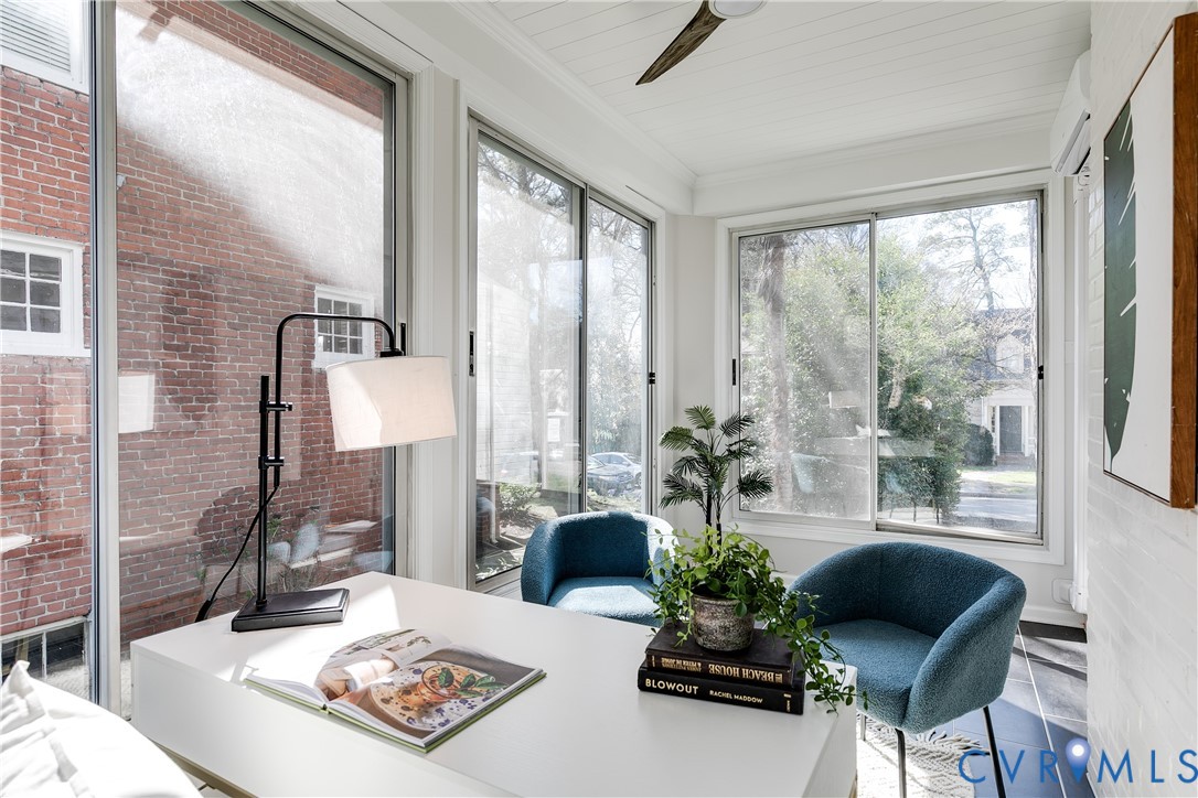 4617 Sylvan Road Richmond, VA 23225 - Photo 14 of 33 a living room with furniture and a floor to ceiling window