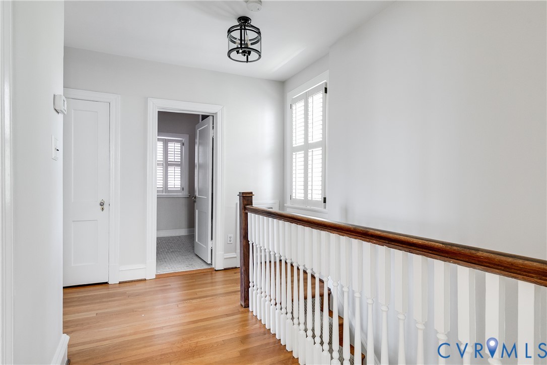 4617 Sylvan Road Richmond, VA 23225 - Photo 21 of 33 a view of a hallway with wooden floor and windows