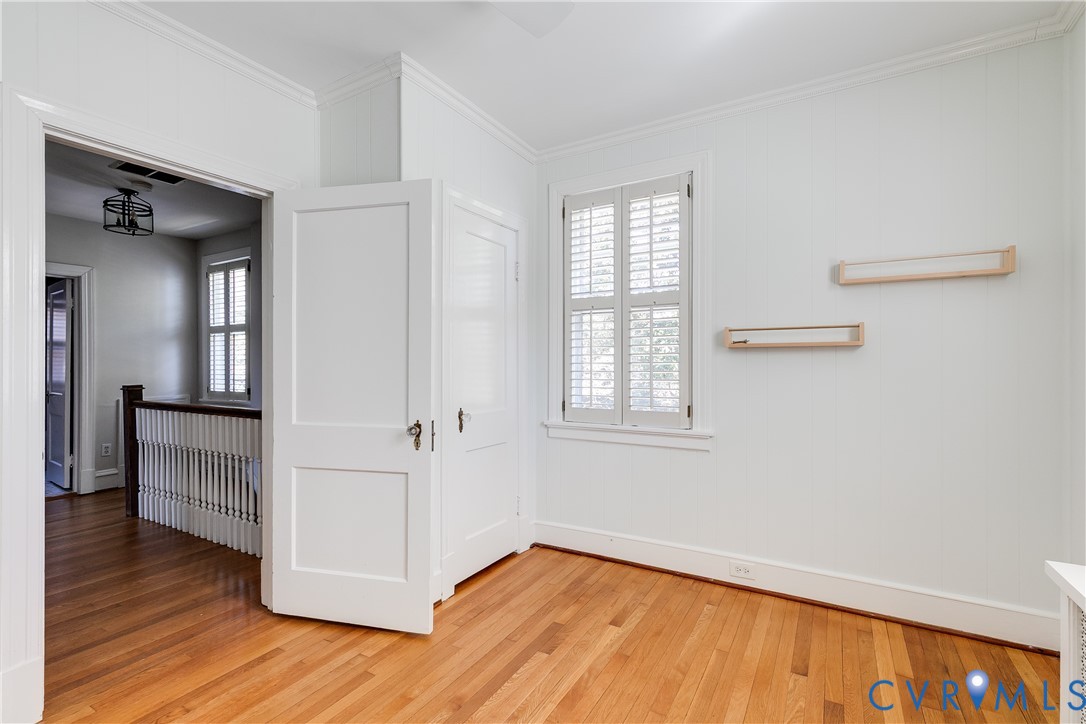 4617 Sylvan Road Richmond, VA 23225 - Photo 23 of 33 wooden floor in an empty room with a window