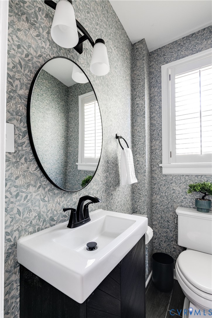 4617 Sylvan Road Richmond, VA 23225 - Photo 24 of 33 a bathroom with a sink mirror and toilet
