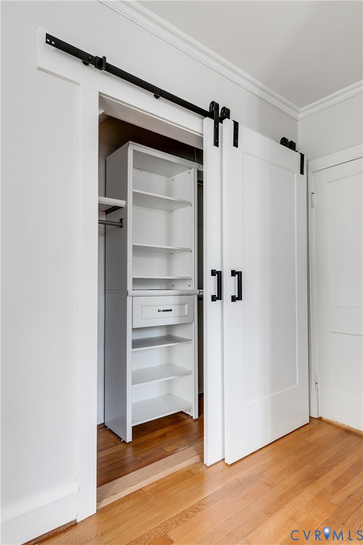 4617 Sylvan Road Richmond, VA 23225 - Photo 26 of 33 a view of walk in closet with empty racks