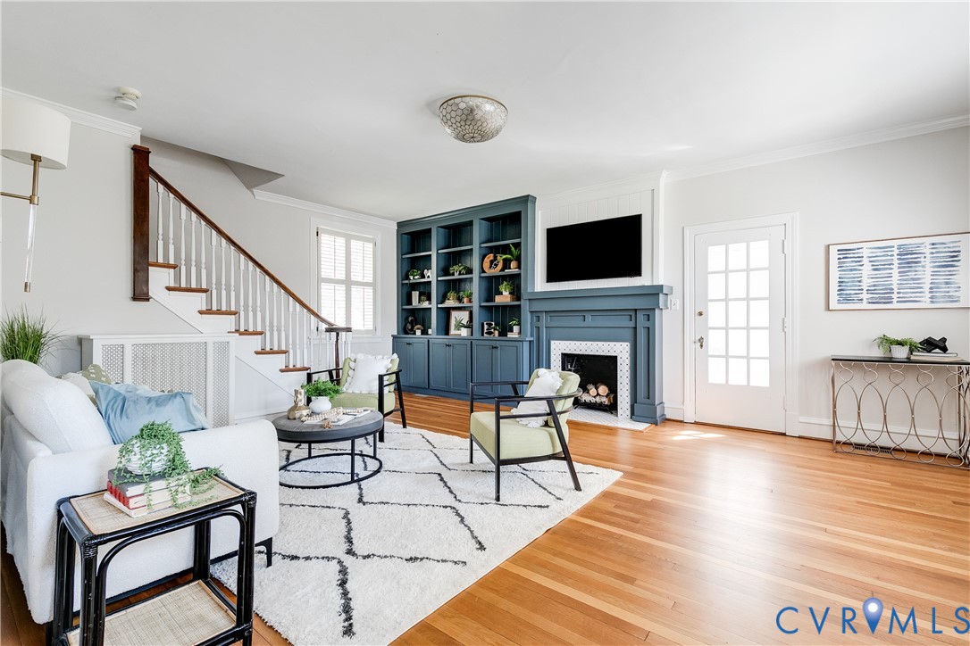 4617 Sylvan Road Richmond, VA 23225 - Photo 3 of 33 a living room with furniture a flat screen tv and a fireplace