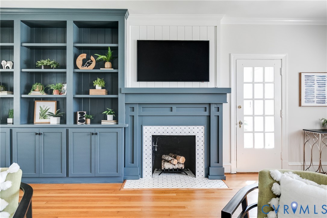 4617 Sylvan Road Richmond, VA 23225 - Photo 4 of 33 a living room with fireplace and a flat screen tv