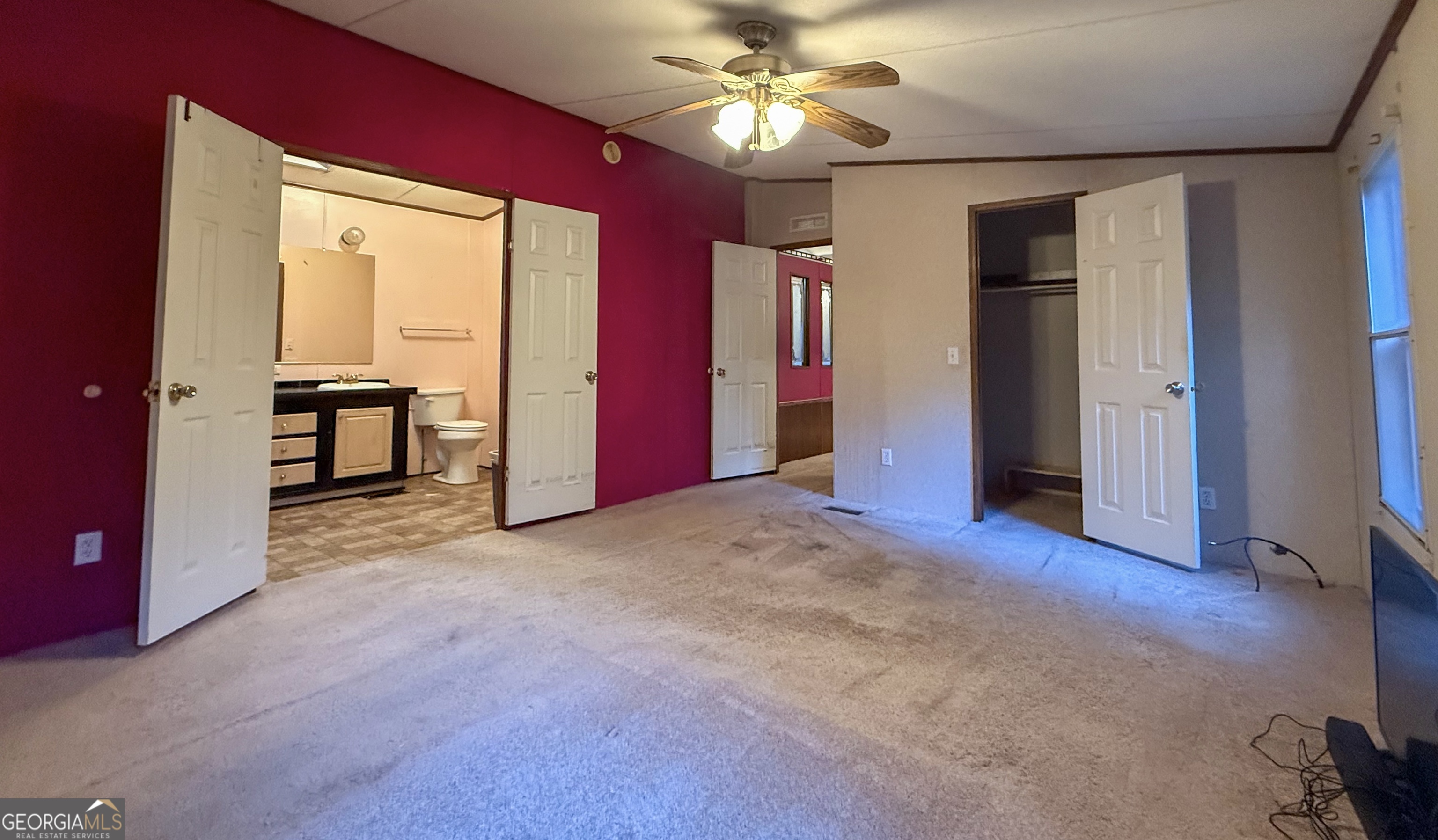 431 Paradise Valley Road Cleveland, GA 30528 - Photo 11 of 27 a view of a livingroom with a sofa and a ceiling fan