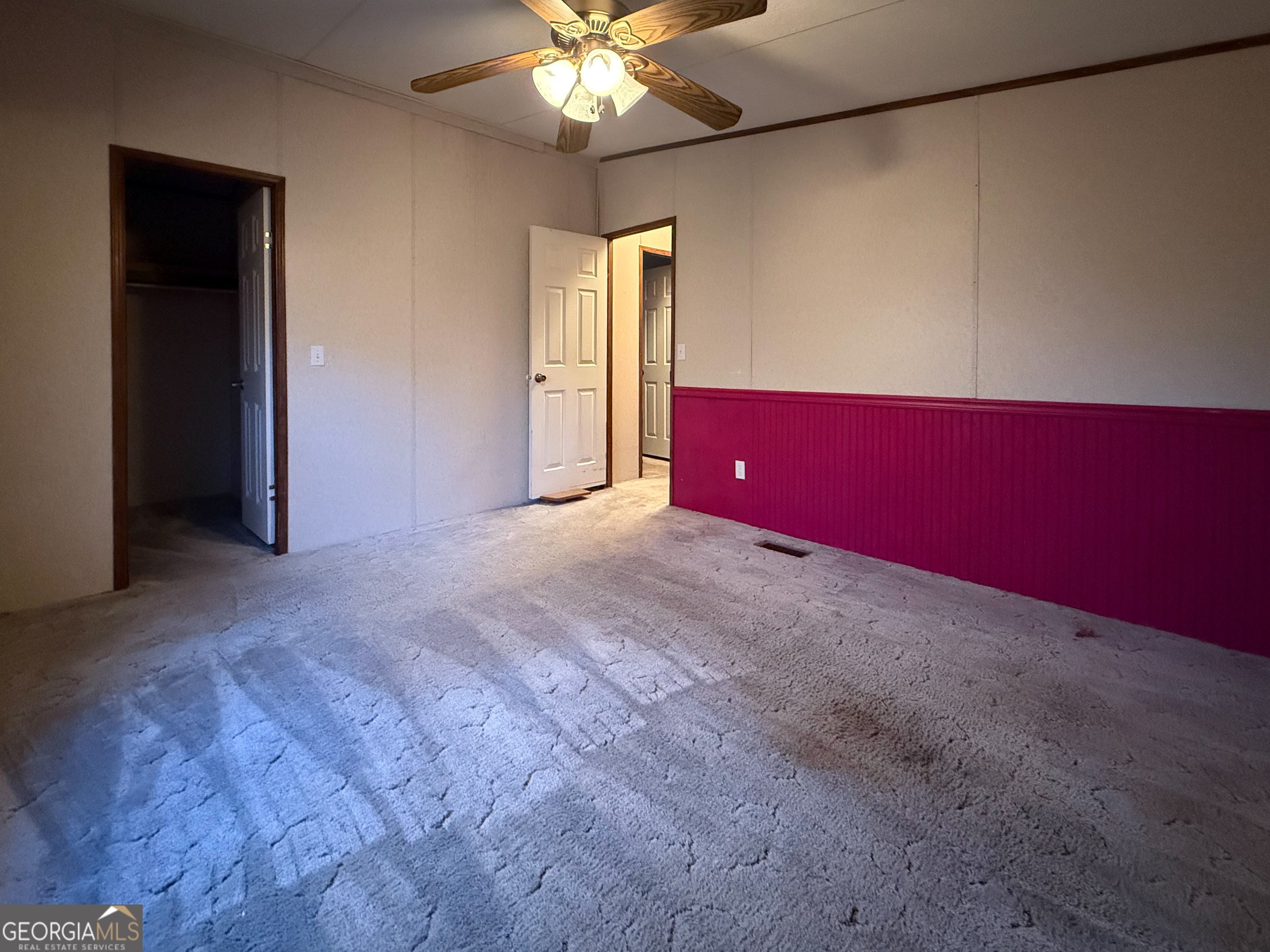 431 Paradise Valley Road Cleveland, GA 30528 - Photo 17 of 27 a view of an empty room with a chandelier fan