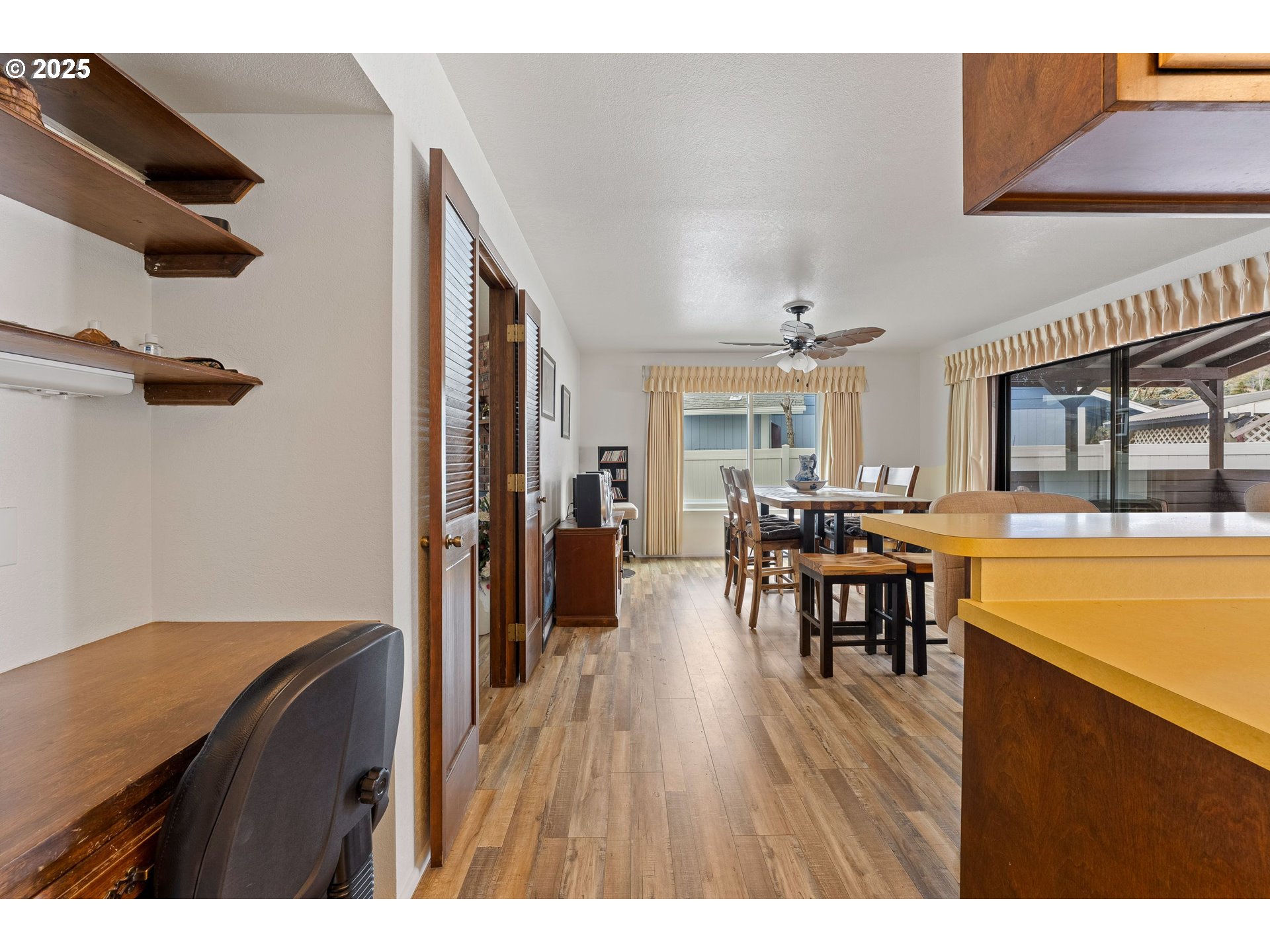 109 Hickory Drive Rogue River, OR 97537 - Photo 11 of 28 a open kitchen with stainless steel appliances granite countertop a stove a refrigerator a dining table and chairs with wooden floor