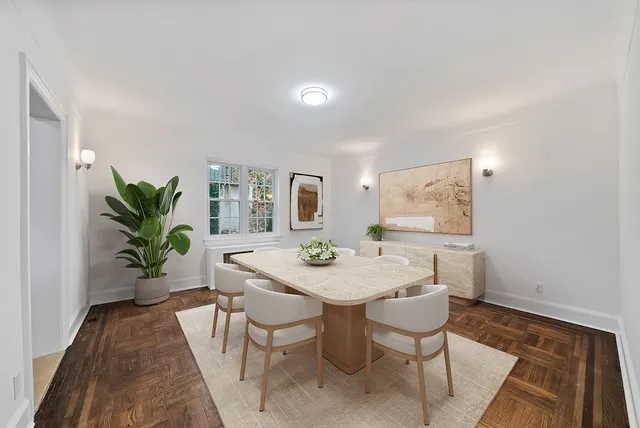 a view of empty room with wooden floor and fireplace