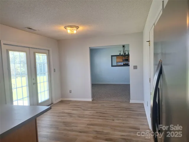 a room with a sink and cabinets
