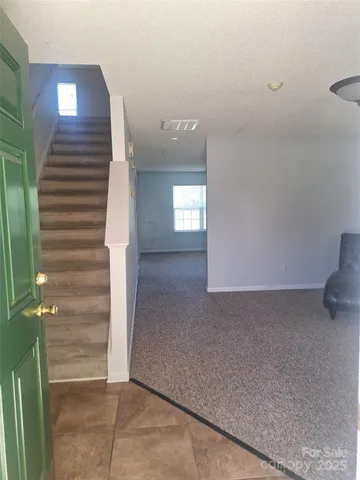 a view of entryway and hall with a window