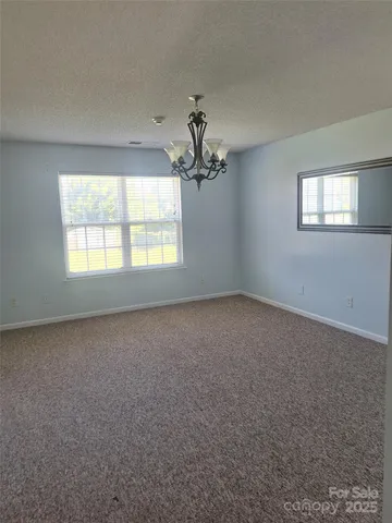 a view of a kitchen cabinets and a window