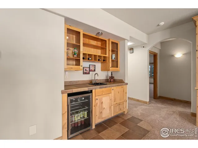 a kitchen with granite countertop a sink and a stove top oven