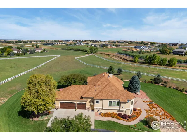 an aerial view of a house with a garden