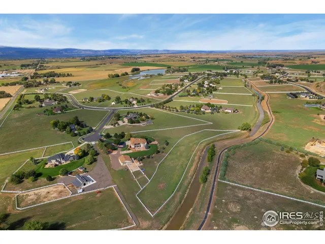 an aerial view of a house with a garden
