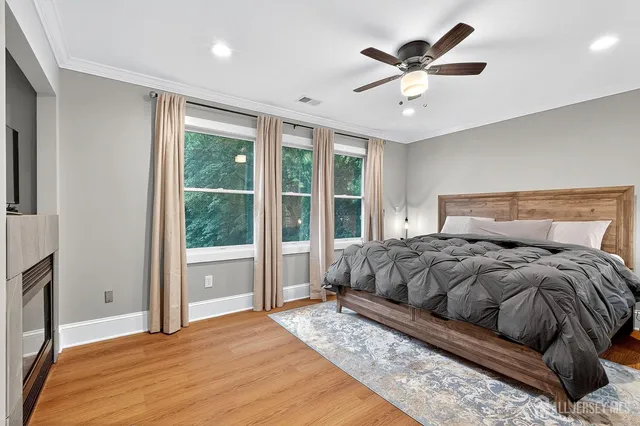 a bed room with a bed and a large window