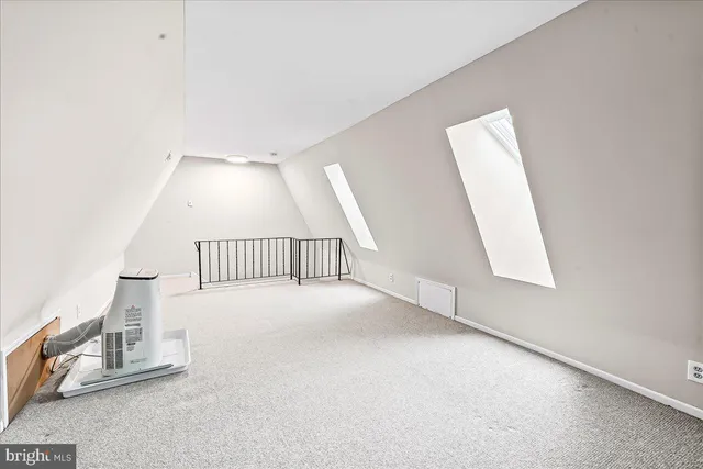 an entryway in a hall with a window