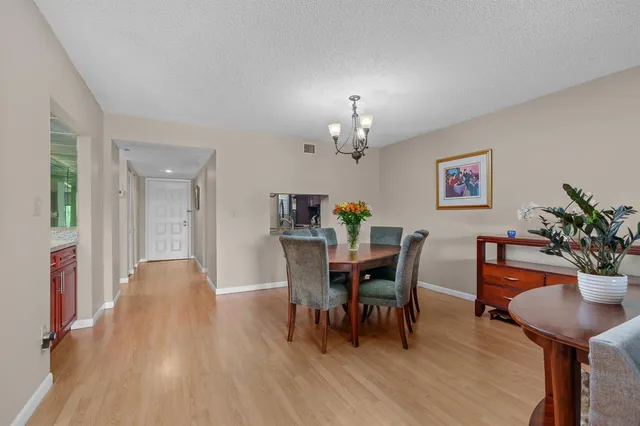 a view of kitchen with furniture and wooden floor