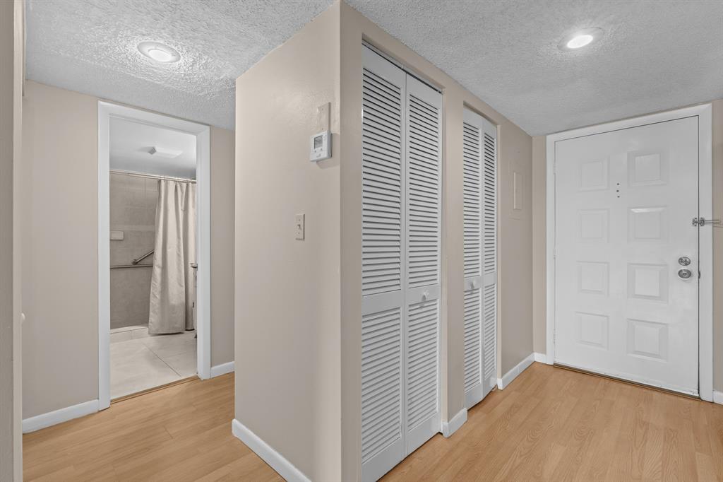 16051 Blatt Boulevard, Unit 212 Weston, FL 33326 - Photo 19 of 52 wooden floor in an empty room