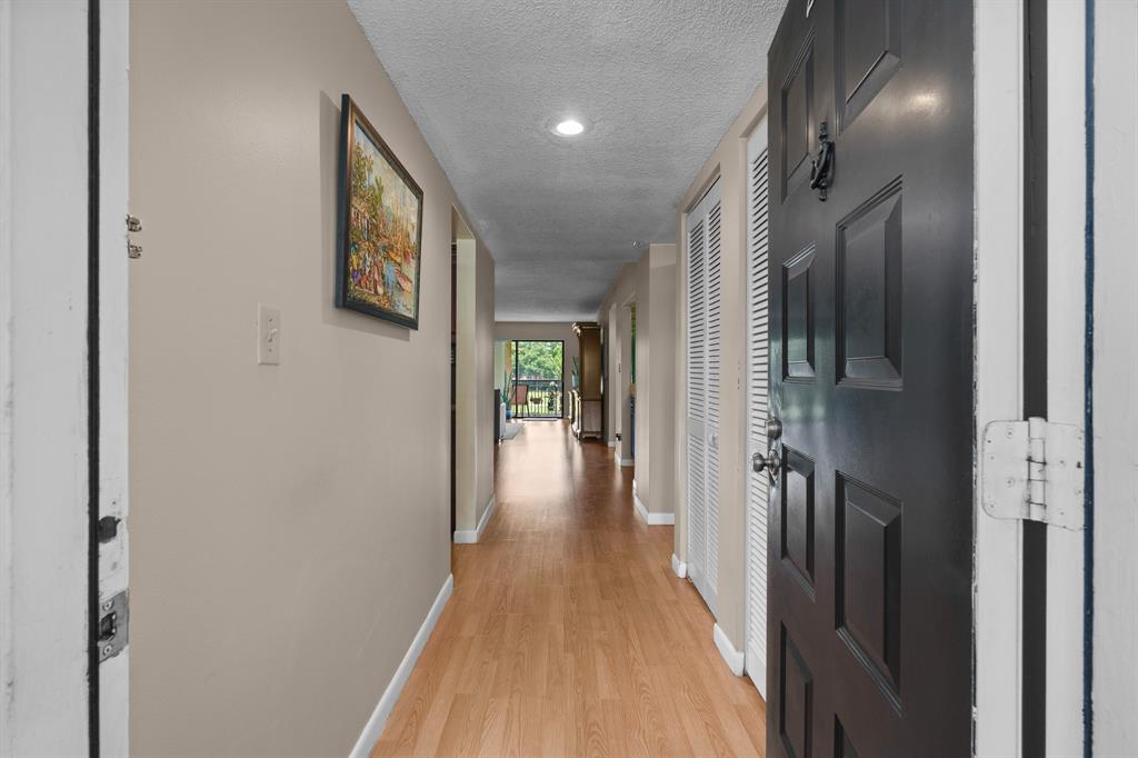 16051 Blatt Boulevard, Unit 212 Weston, FL 33326 - Photo 20 of 52 a view of hallway with stainless steel appliances