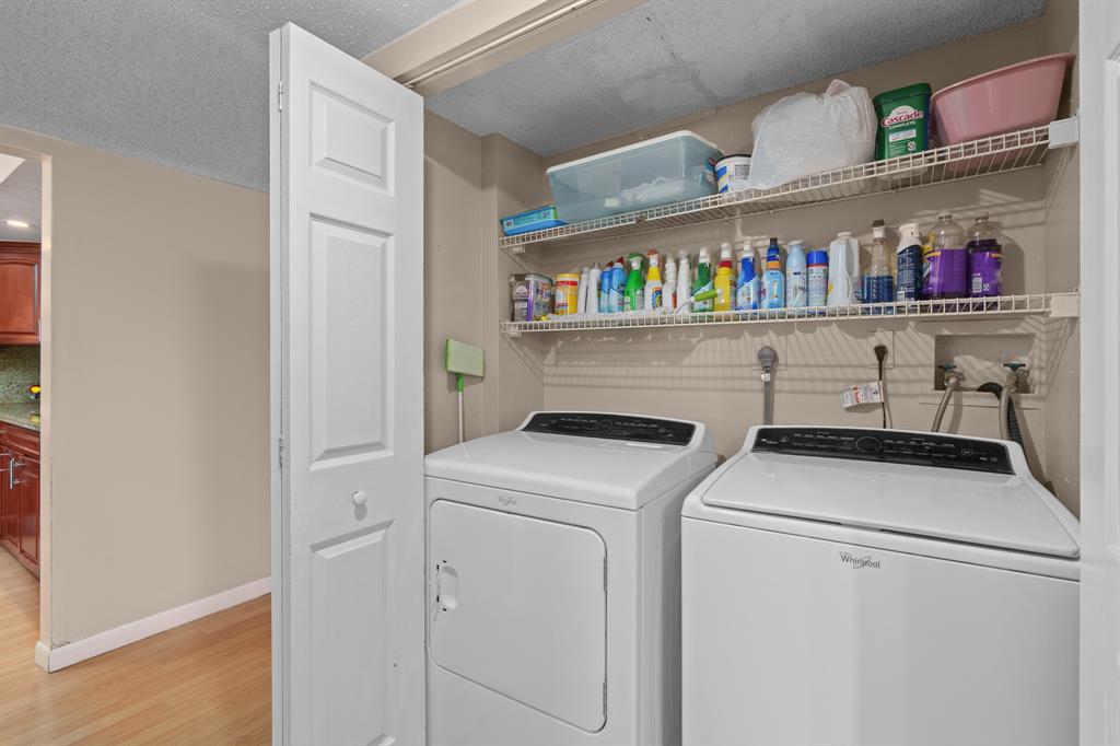 16051 Blatt Boulevard, Unit 212 Weston, FL 33326 - Photo 22 of 52 a utility room with dryer and washer