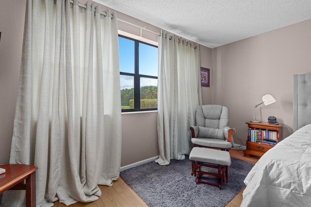 16051 Blatt Boulevard, Unit 212 Weston, FL 33326 - Photo 30 of 52 a living room with furniture and a window