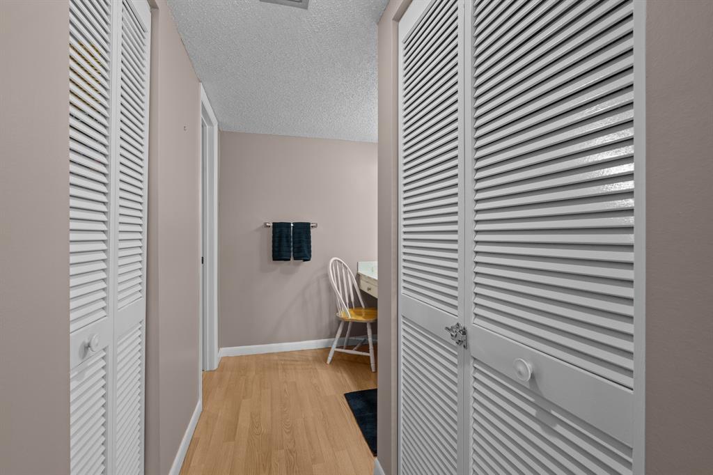 16051 Blatt Boulevard, Unit 212 Weston, FL 33326 - Photo 32 of 52 a view of a room that has a chair and white walls