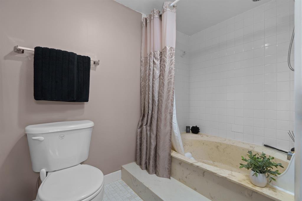 16051 Blatt Boulevard, Unit 212 Weston, FL 33326 - Photo 35 of 52 a bathroom with a toilet a sink and bathtub