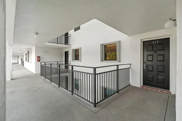 a view of a house with a yard and plants