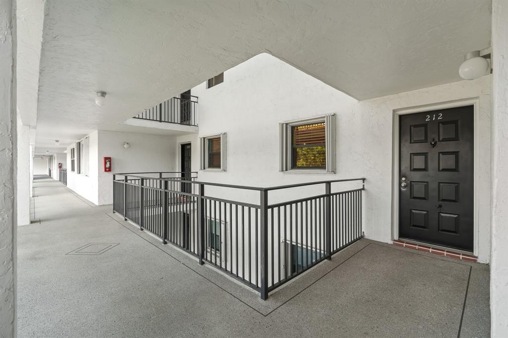16051 Blatt Boulevard, Unit 212 Weston, FL 33326 - Photo 38 of 52 a view of a hallway with closet and entryway