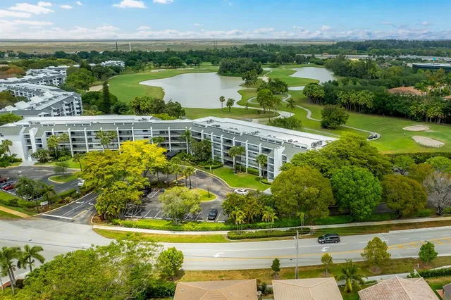 an aerial view of a house with a swimming pool