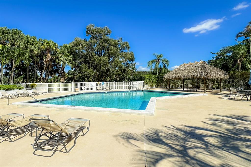 16051 Blatt Boulevard, Unit 212 Weston, FL 33326 - Photo 43 of 52 a view of a swimming pool with a yard