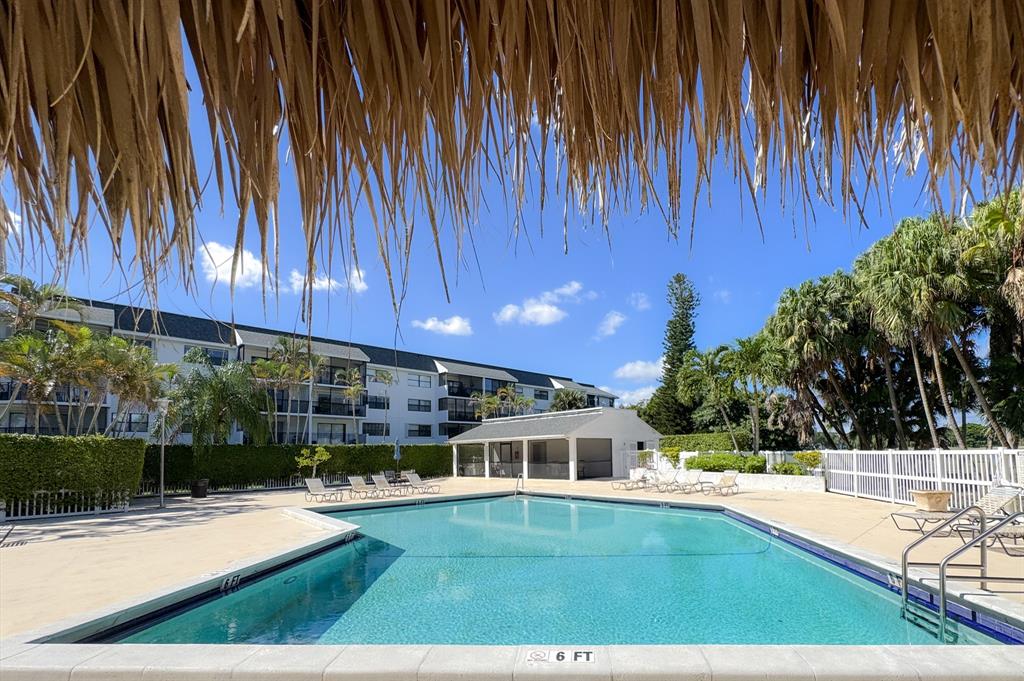 16051 Blatt Boulevard, Unit 212 Weston, FL 33326 - Photo 44 of 52 a view of a house with backyard and sitting area