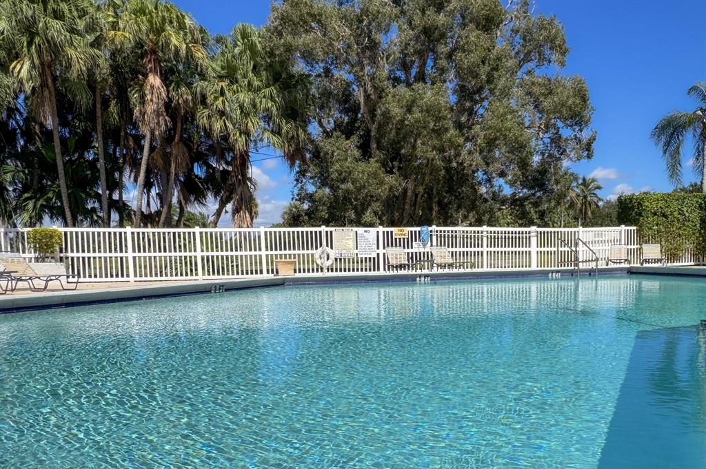 16051 Blatt Boulevard, Unit 212 Weston, FL 33326 - Photo 45 of 52 a view of a yard with wooden fence