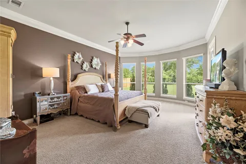 a view of a livingroom with furniture and floor to ceiling window