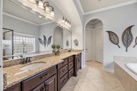 a spacious bedroom with a bed couch and a large window