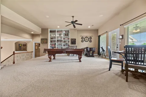 a large bedroom with a large bed and furniture